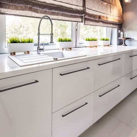 Ravinte cabinet handles on a kitchen drawer in matte black style.