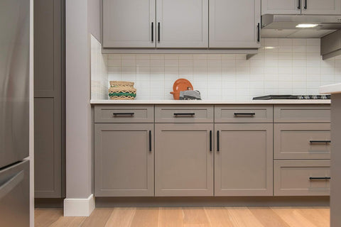 Matte black Ravinte pull shown on a drawer for a monochrome look.