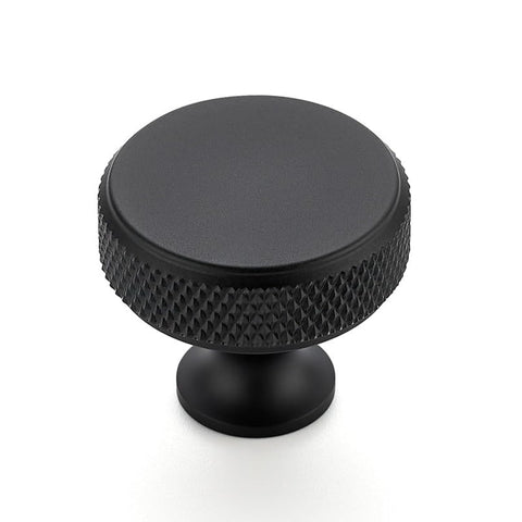 Ravinte round knob in matte black enhances kitchen cabinets with a sleek, durable finish.