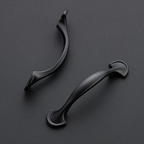 Ravinte rounded-foot arch pull in matte black enhances drawers' grip.