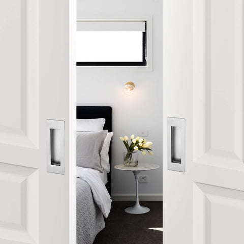 Ravinte sliding barn door handle in-use on a modern interior for guided operation.