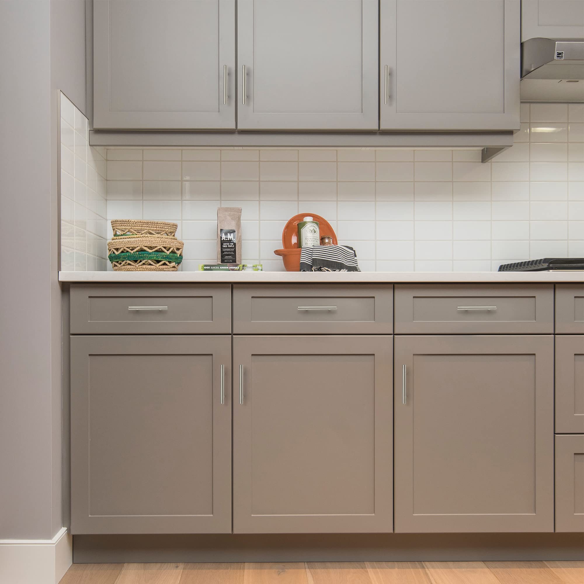 Ravinte stainless steel cabinet pulls complement warm wood cabinetry