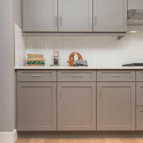 Ravinte stainless steel cabinet pulls complement warm wood cabinetry