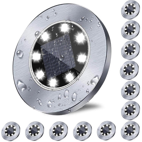 Rayolon solar ground light lighting a pathway with bright white illumination at night