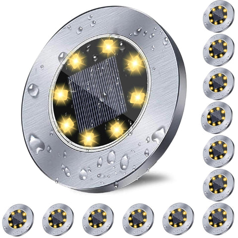 Rayolon solar ground lights illuminate pathways with a warm, wire-free glow.