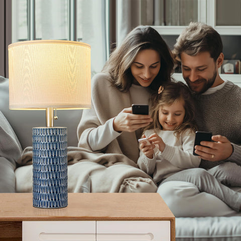 Reaketon table lamp with dark blue ceramic base and fabric shade for soothing lighting