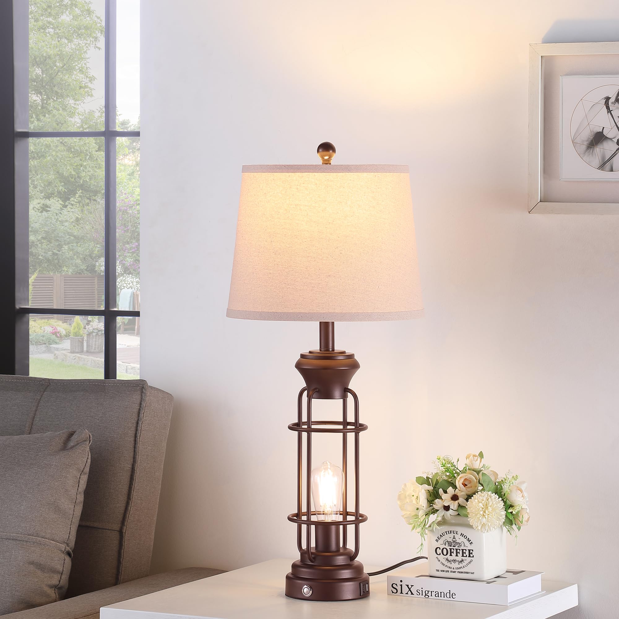 Reaketon white oatmeal shade atop bronze base creates cozy bedroom lighting.