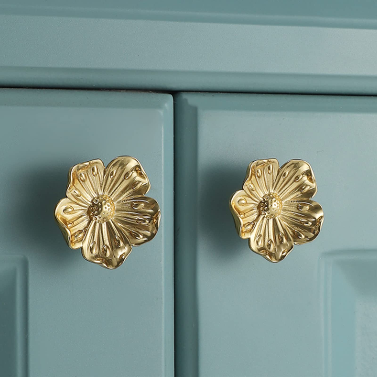 Redeam flower knob mounted on a drawer, showcasing luxe brass detail