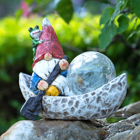 Rezpuao garden gnome statue with solar light enhances outdoor charm and night visibility.
