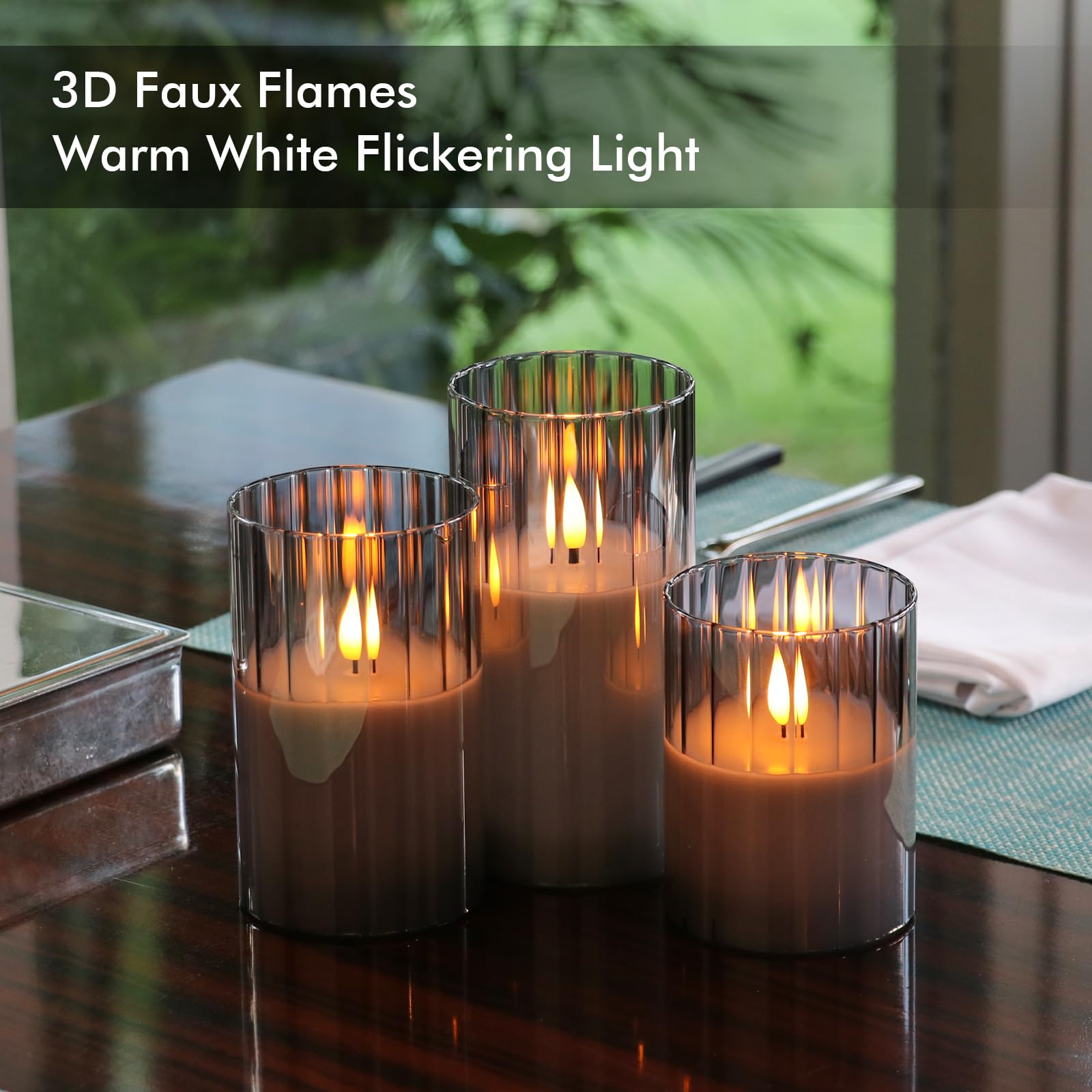 Close-up of smoked ribbed glass candle showing warm, diffused glow.