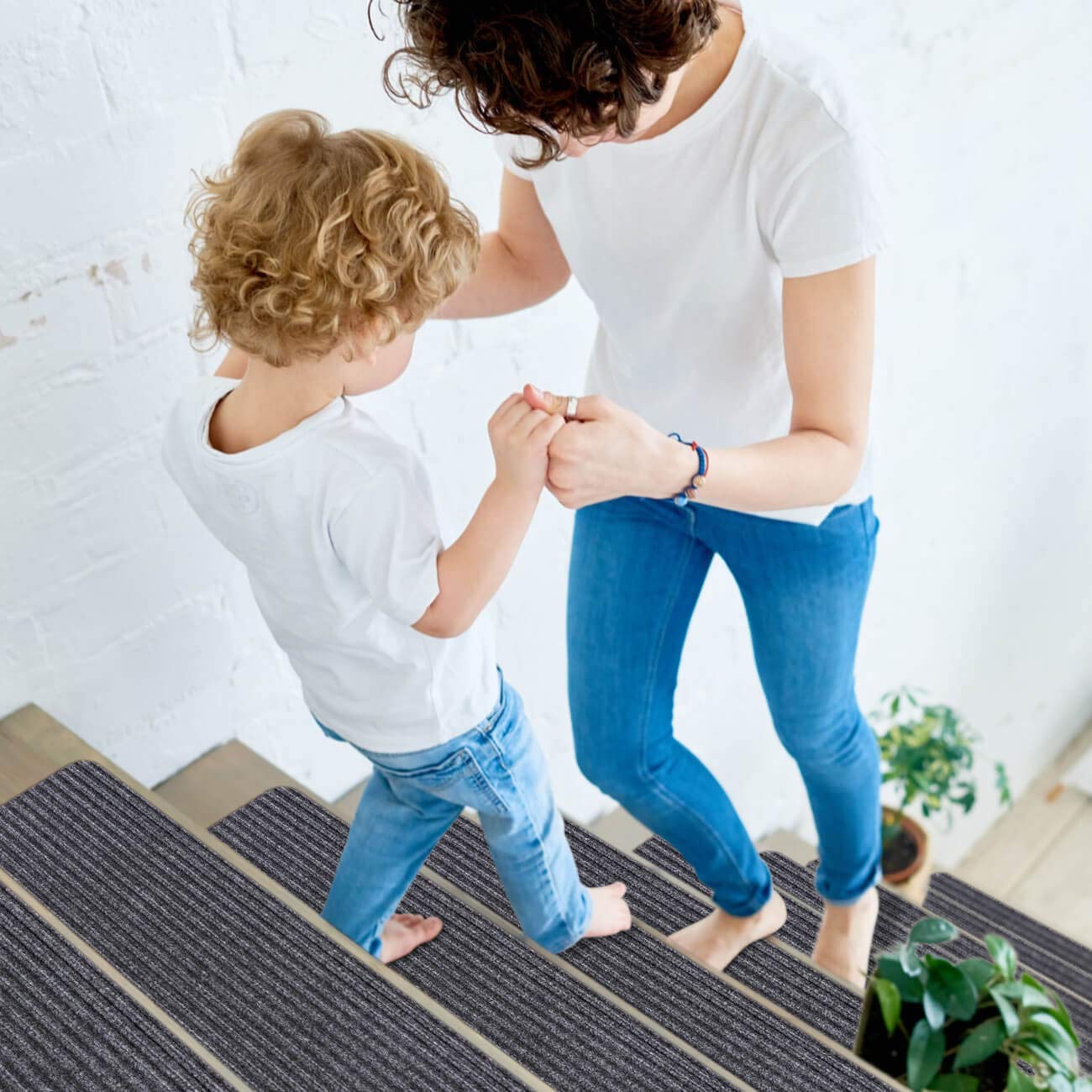 RIOLAND stair runners on wooden steps offer quiet grip and protection.
