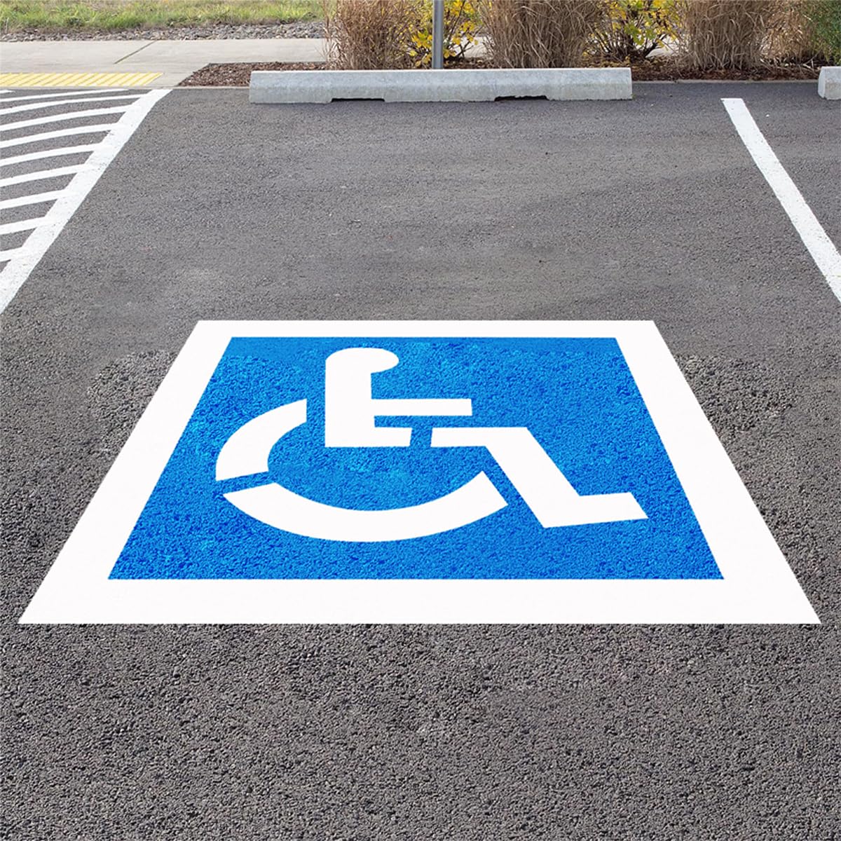 RoadAlchemist handicap stencil setup on pavement for precise ISA symbol and ADA compliance.