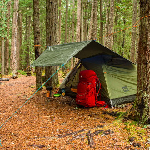 Rocutus tarp shields gear from heavy rain and UV rays.