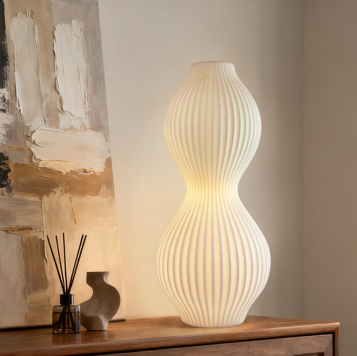 RONDURE ceramic table lamp side view for a cozy bedroom glow.