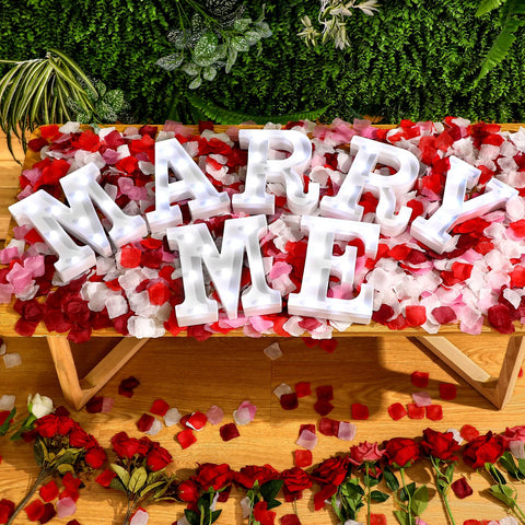 Roowest rose petals mix adds color and texture for a luxurious proposal setup