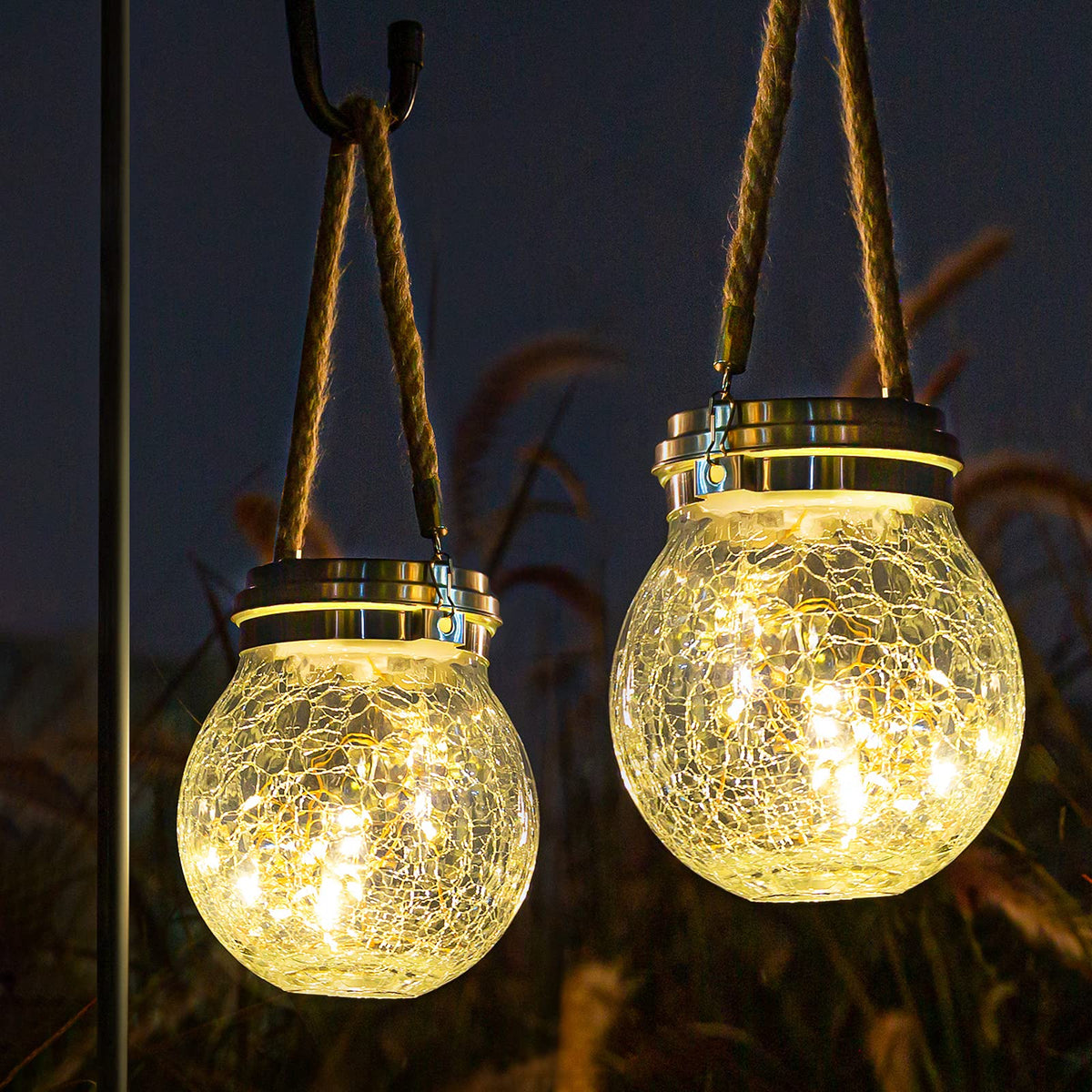 ROSHWEY 2 pack solar lanterns hanging outdoors for warm ambience