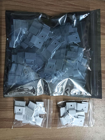 Rxment mounting clips for outdoor LED strips with adhesive tape for durable installation.