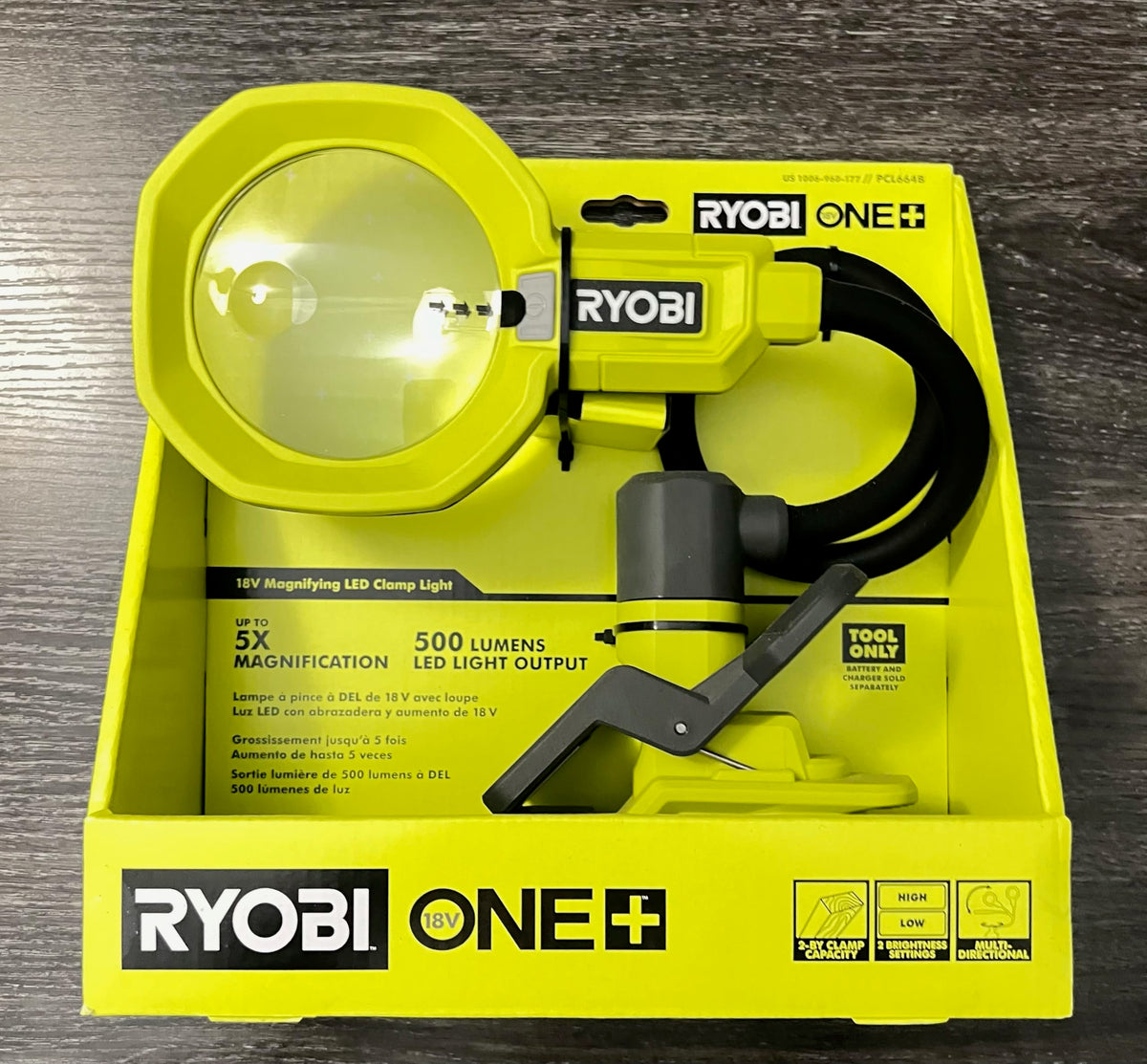 RYOBI ONE+ LED magnifying clamp light with 3.5-inch lens for precise inspection and hands-free illumination.