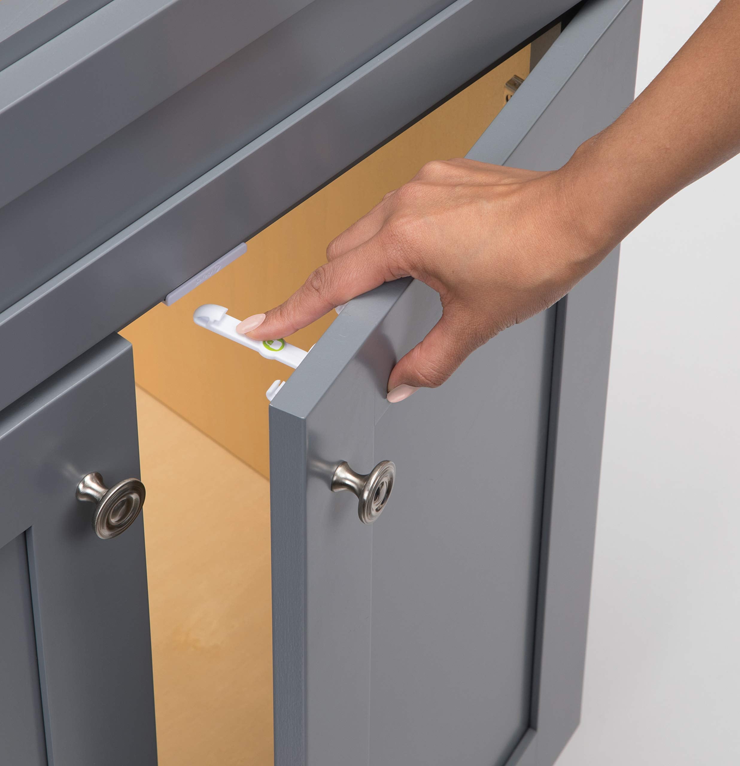 Safety 1st Adhesive Cabinet Latch installation demonstrates tool-free setup for quick childproofing.
