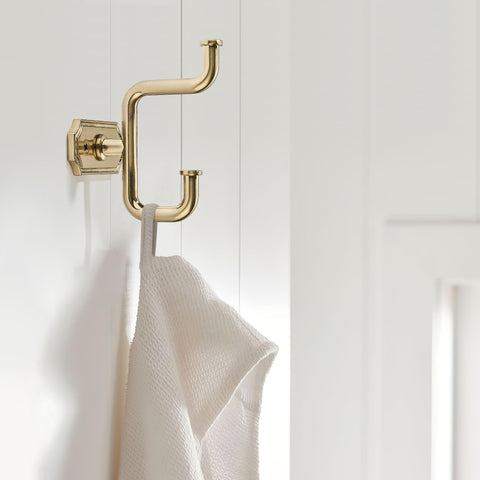 SAILING bathroom hardware in champagne gold adds elegant storage and accessible use.