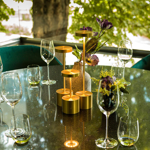 SAKRINGT minimalist gold-finish lamp adds warm ambience to any table.
