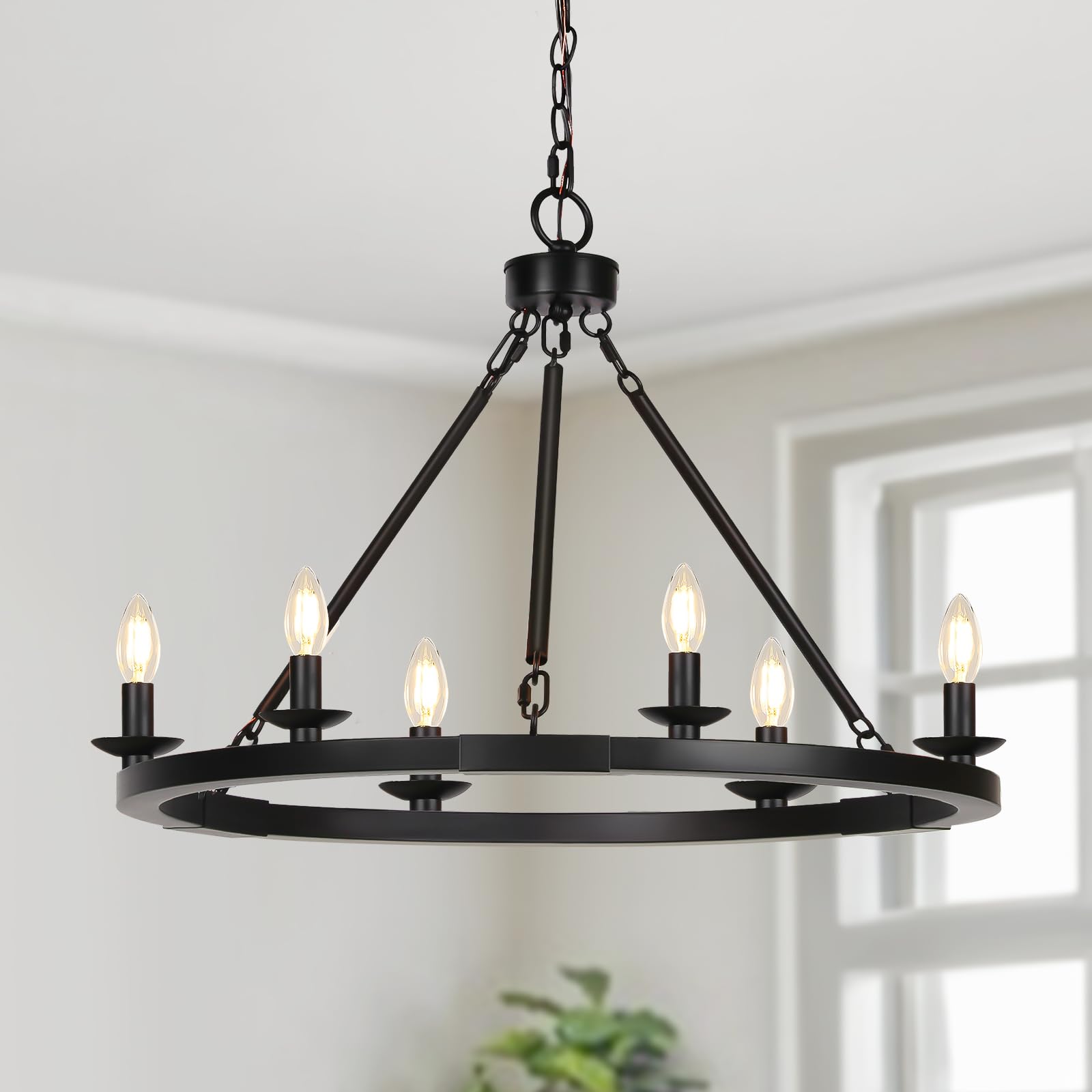 Seaside Village Black Farmhouse Chandelier with wagon wheel for warm dining room ambiance.