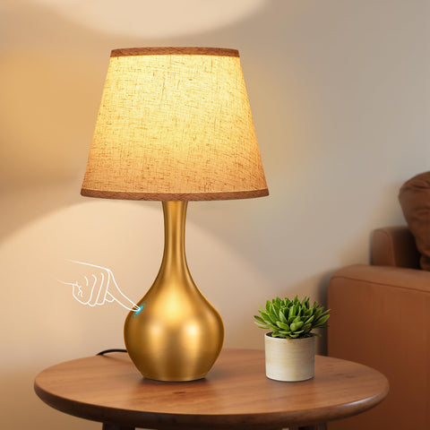 Seealle Touch table lamp with apple base in gold adds elegant bedside ambiance.