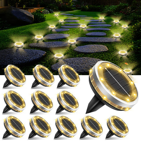 SenLuKit solar ground lights 12-pack illuminate walkways with warm glow.