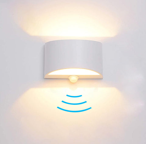SERDEN LED wall sconce front view glowing in warm 3000K light for cozy ambience