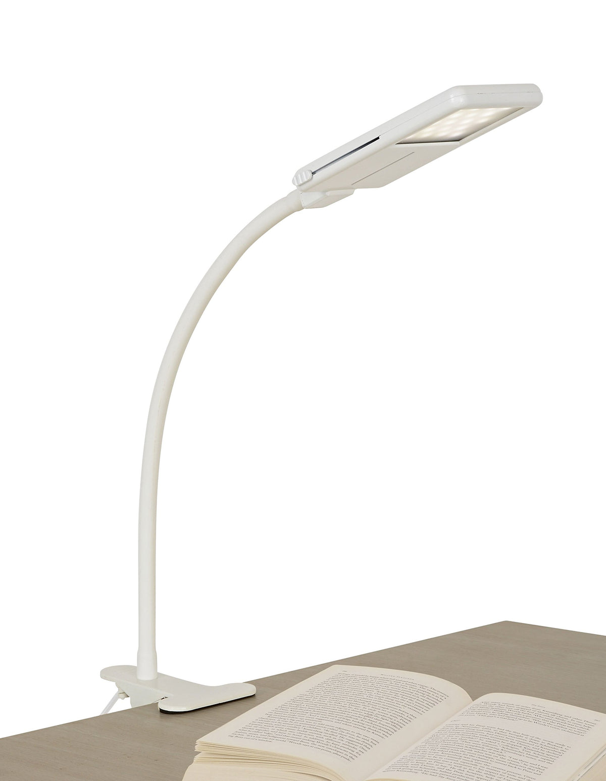 SHABBOSLITE clip-on lamp attached to headboard for focused bedtime reading