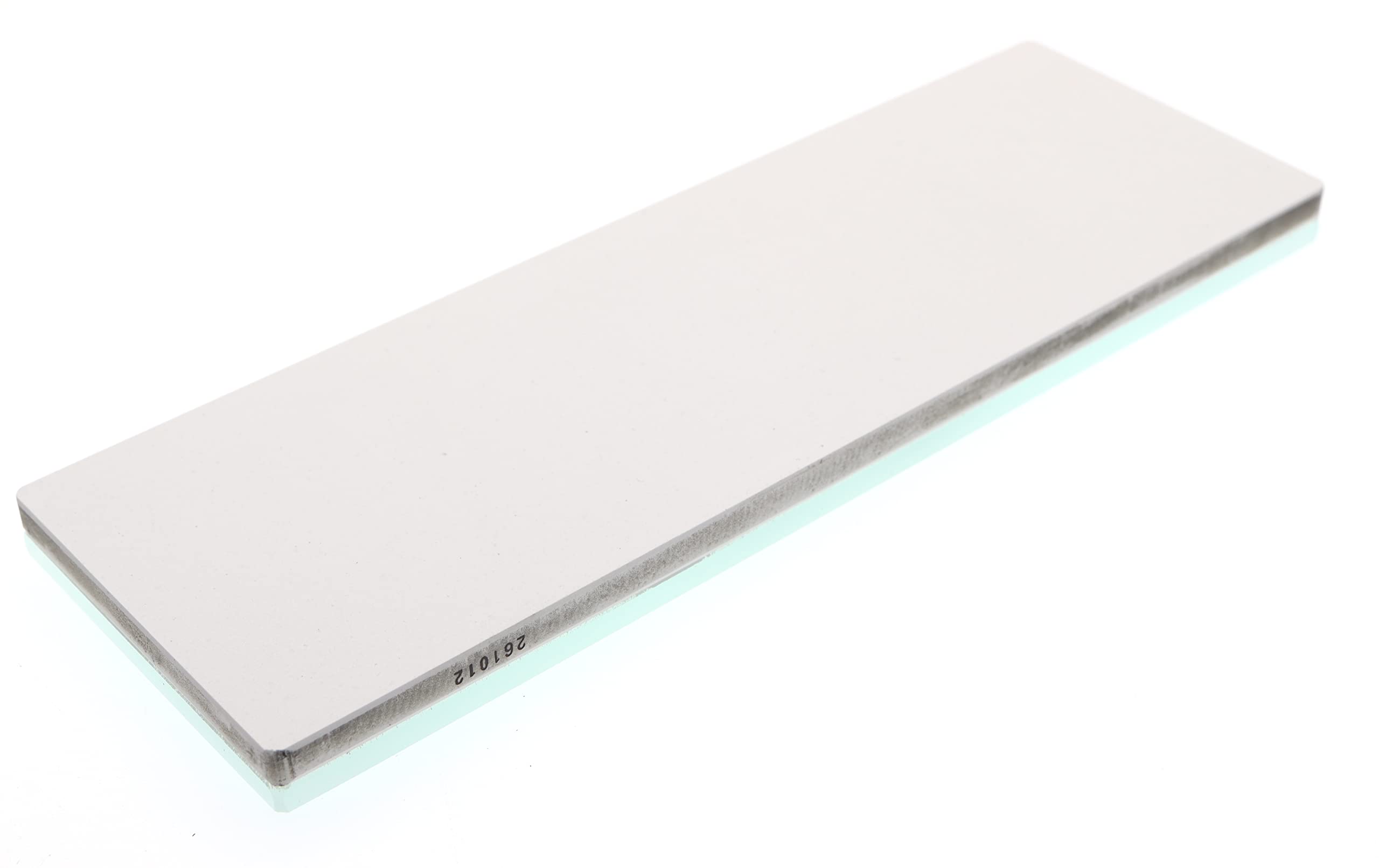 Shapton GlassStone 6000 in use on a blade demonstrates smooth material removal