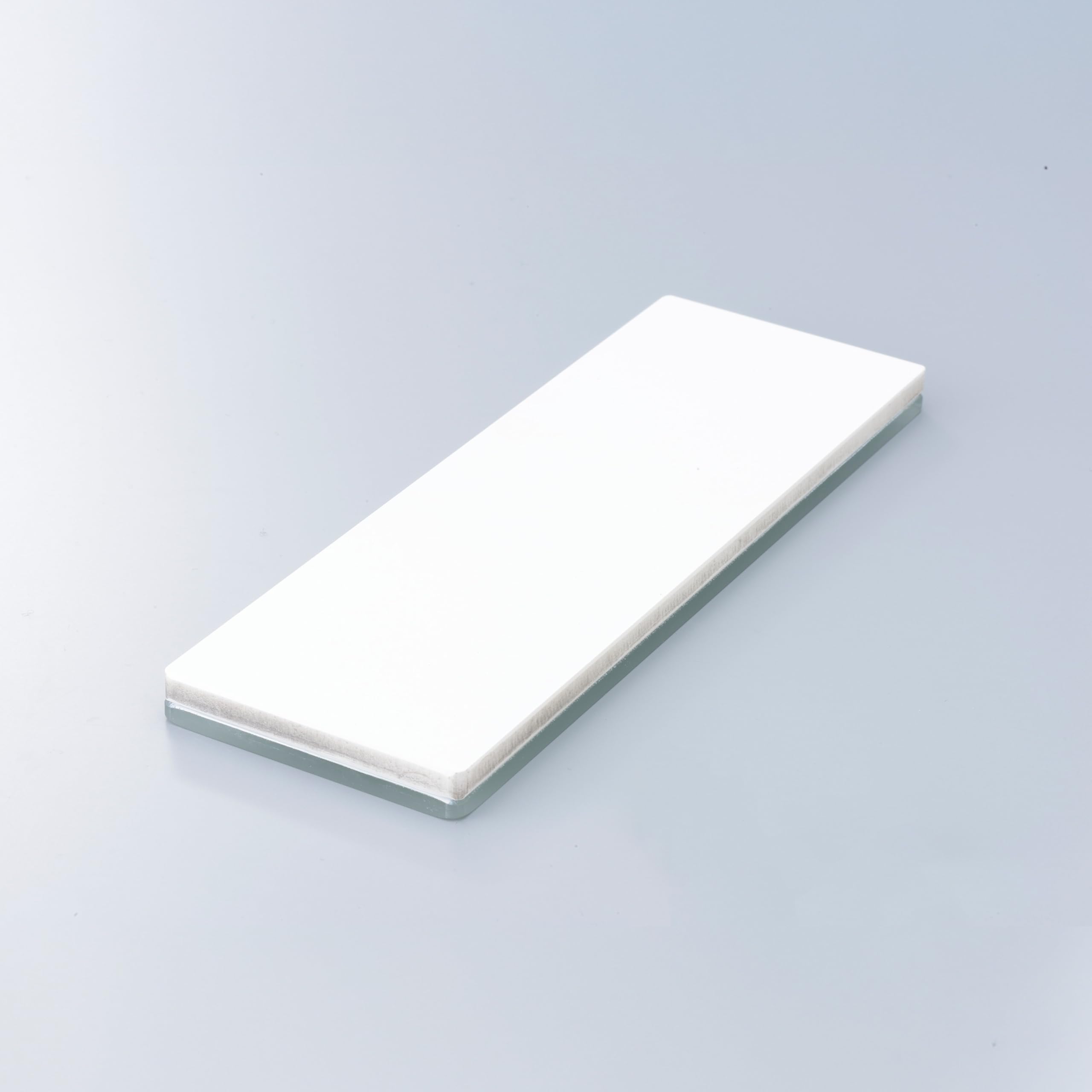 Shapton GlassStone 6000 on wooden stand indicates stable sharpening setup