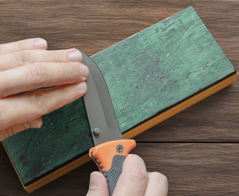 Strop secured on non-slip bamboo base for stable sharpening sessions.