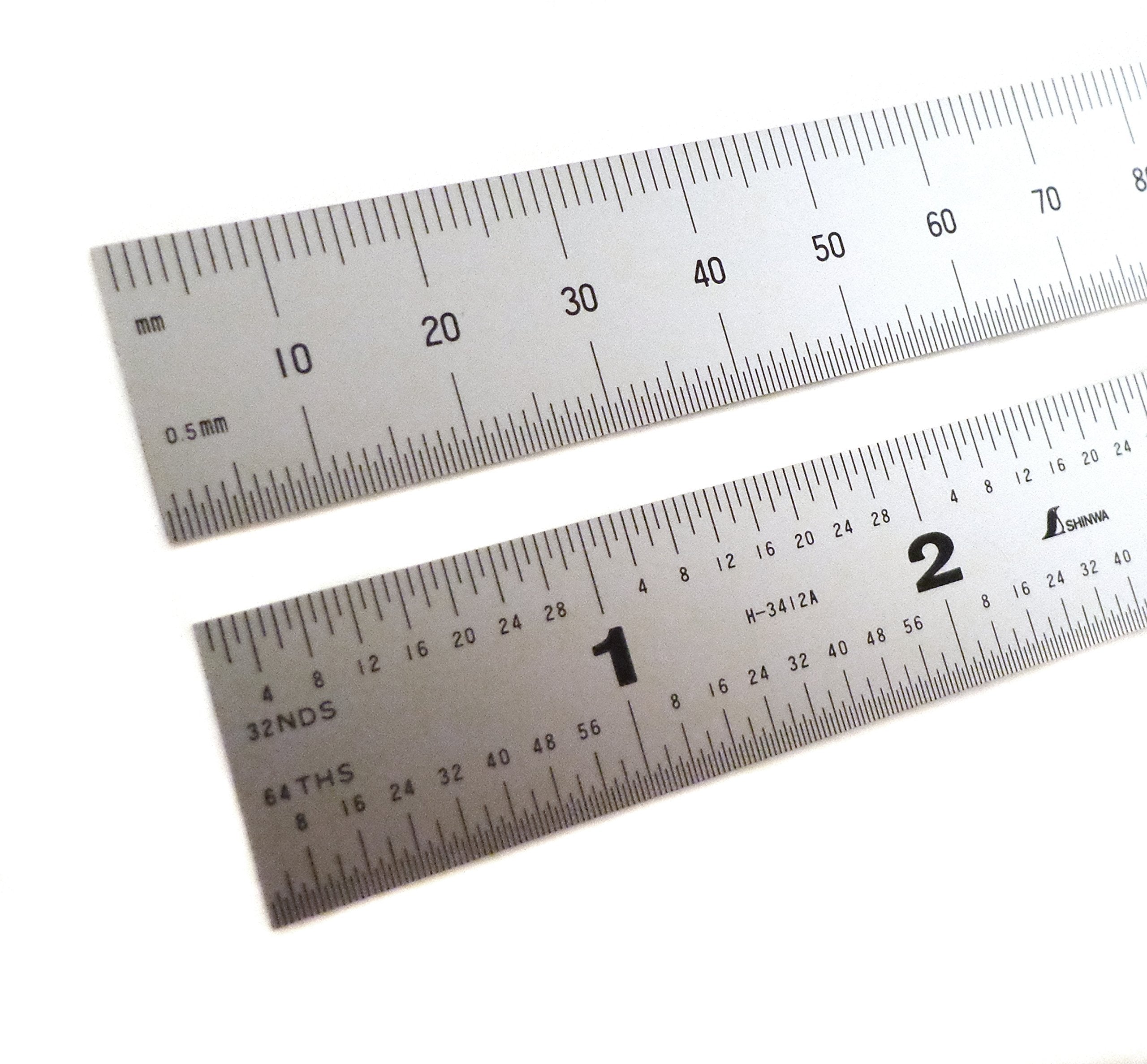 Shinwa zero glare satin chrome ruler for easy measurement in bright workshop lighting.