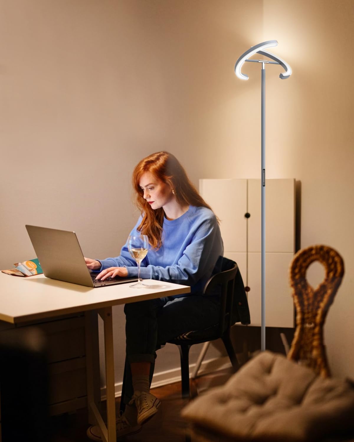 SIBRILLE remote-control floor lamp with magnetic holder keeps controls handy.