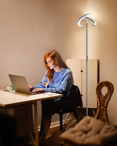 SIBRILLE remote-control floor lamp with magnetic holder keeps controls handy.