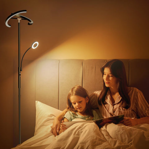 SIBRILLE LED floor lamp enhances bedside illumination in the bedroom