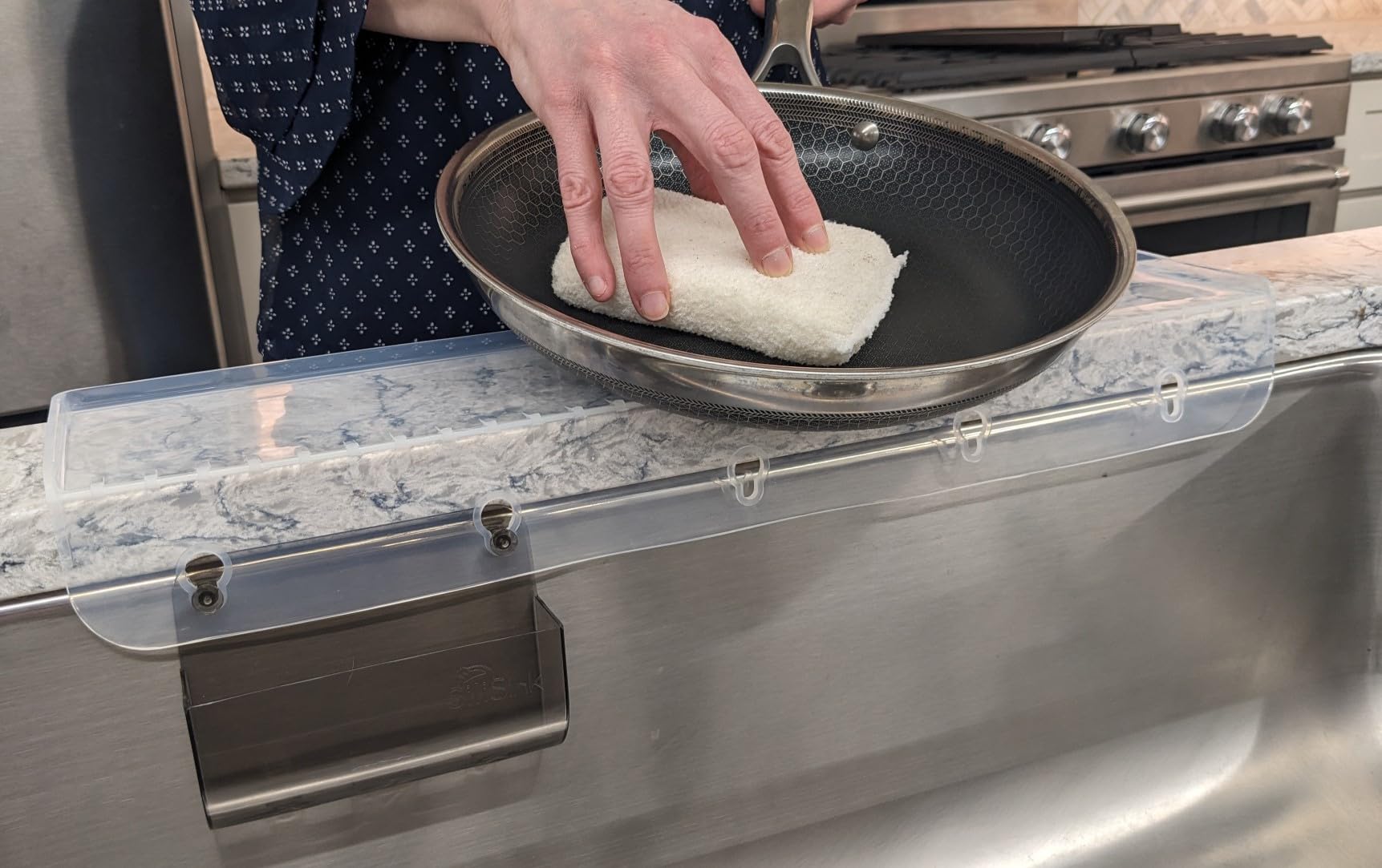 SiliSink XL splash guard channels water back into the sink, reducing splashes