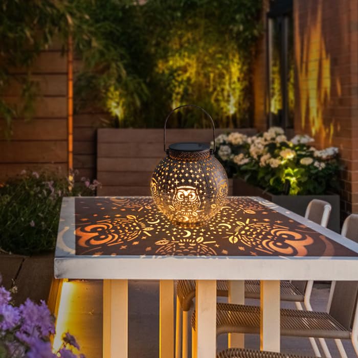 Singingarden Lantern on patio table provides warm ambient light.
