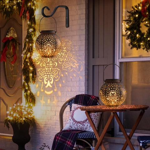 Singingarden Outdoor Lantern Hanging on a tree enhances porch ambiance.