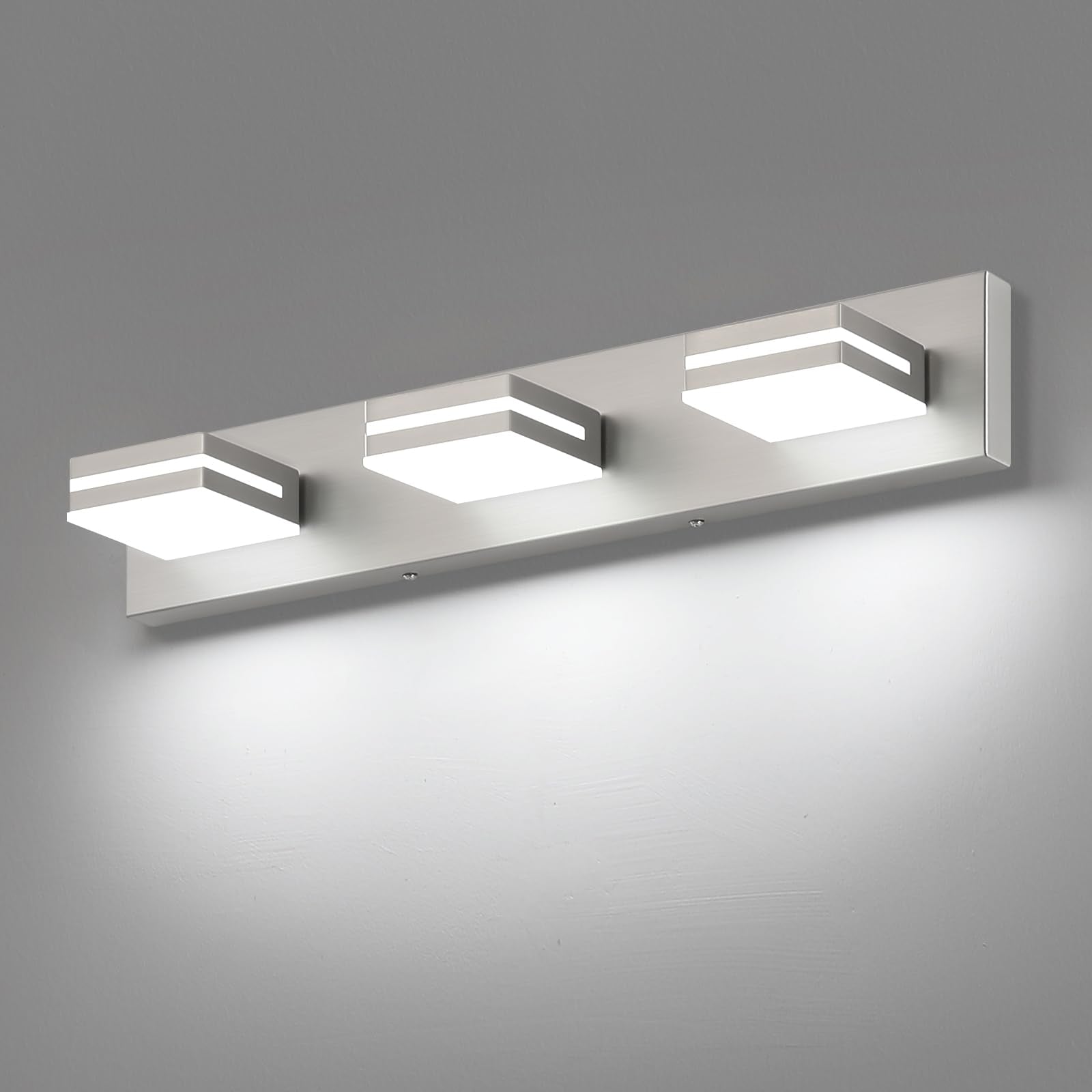 SineRise 3-light vanity fixture in brushed nickel over mirror for even makeup lighting.