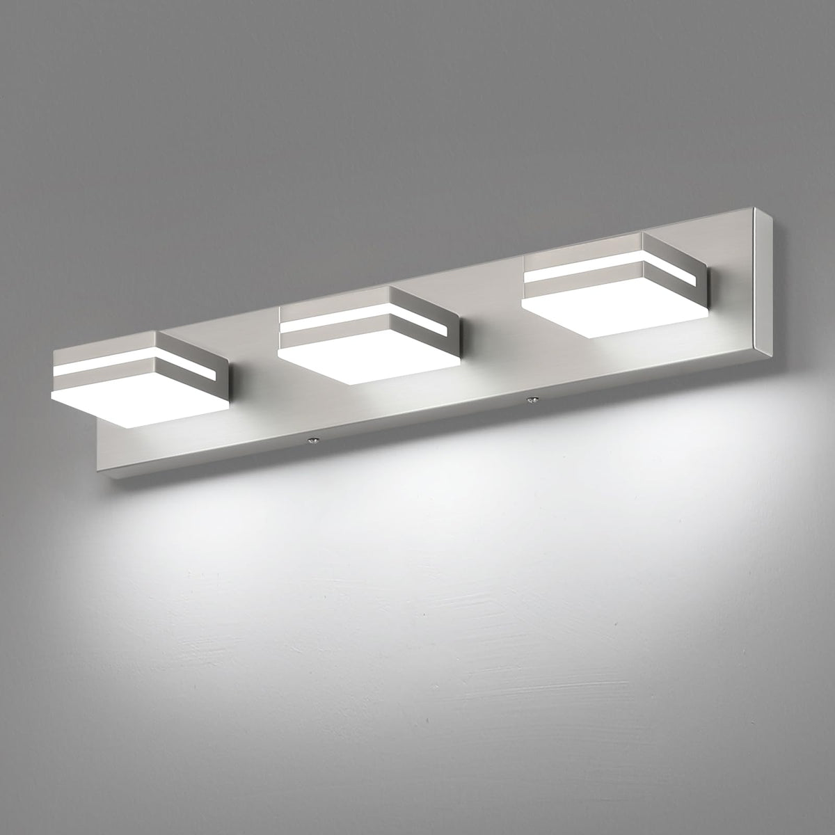 SineRise 3-light vanity fixture in brushed nickel over mirror for even makeup lighting.