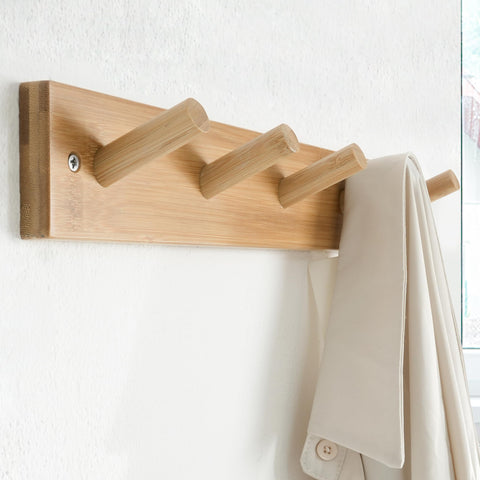 Five pegs detail showing sturdy hanging points for coats and towels
