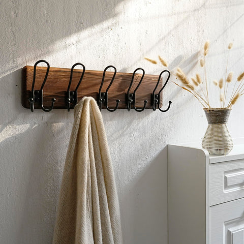 Dual-direction hanging design on SKOLOO coat rack enables easy item access.