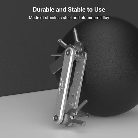 SmallRig folding tool set tucked in a pocket, emphasizing travel-friendly design.
