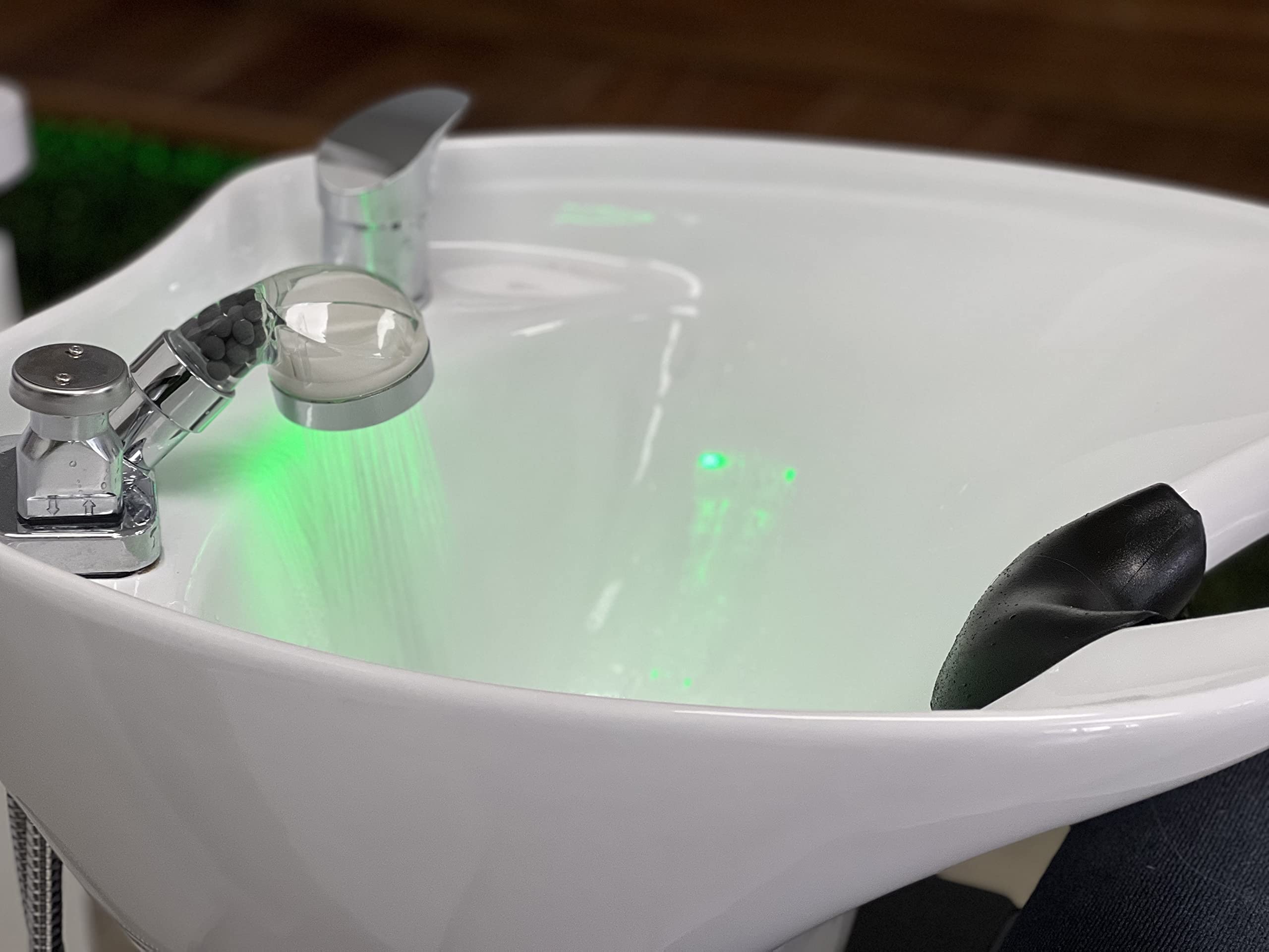 Socila sprayer head installation shot suggests quick salon replacement process.