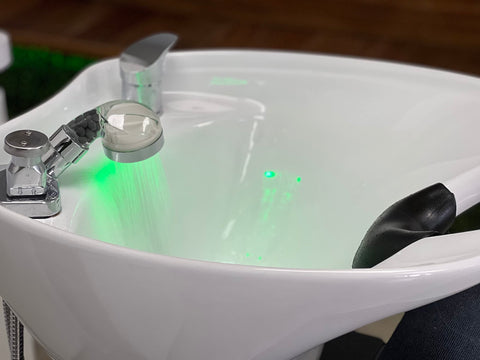 Socila sprayer head installation shot suggests quick salon replacement process.