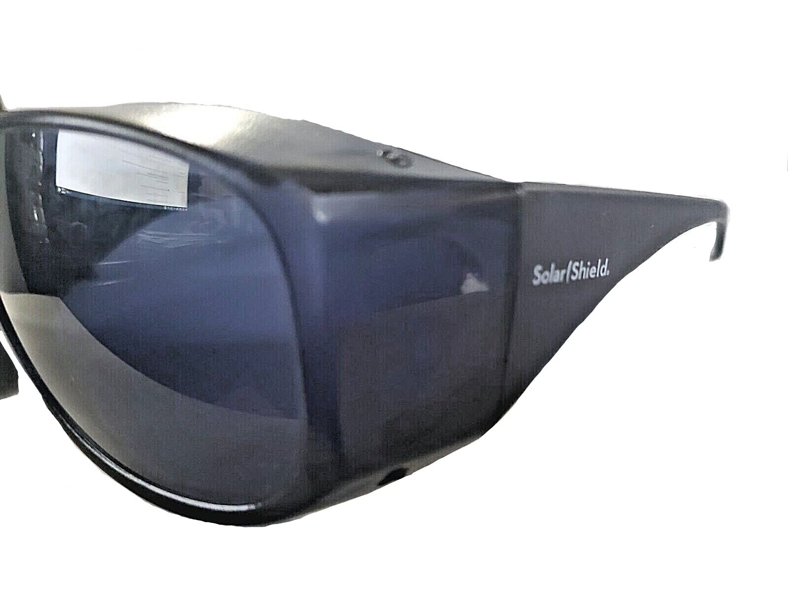 Solar Shield fits-over sunglasses angled view highlighting lightweight, impact-resistant lenses.