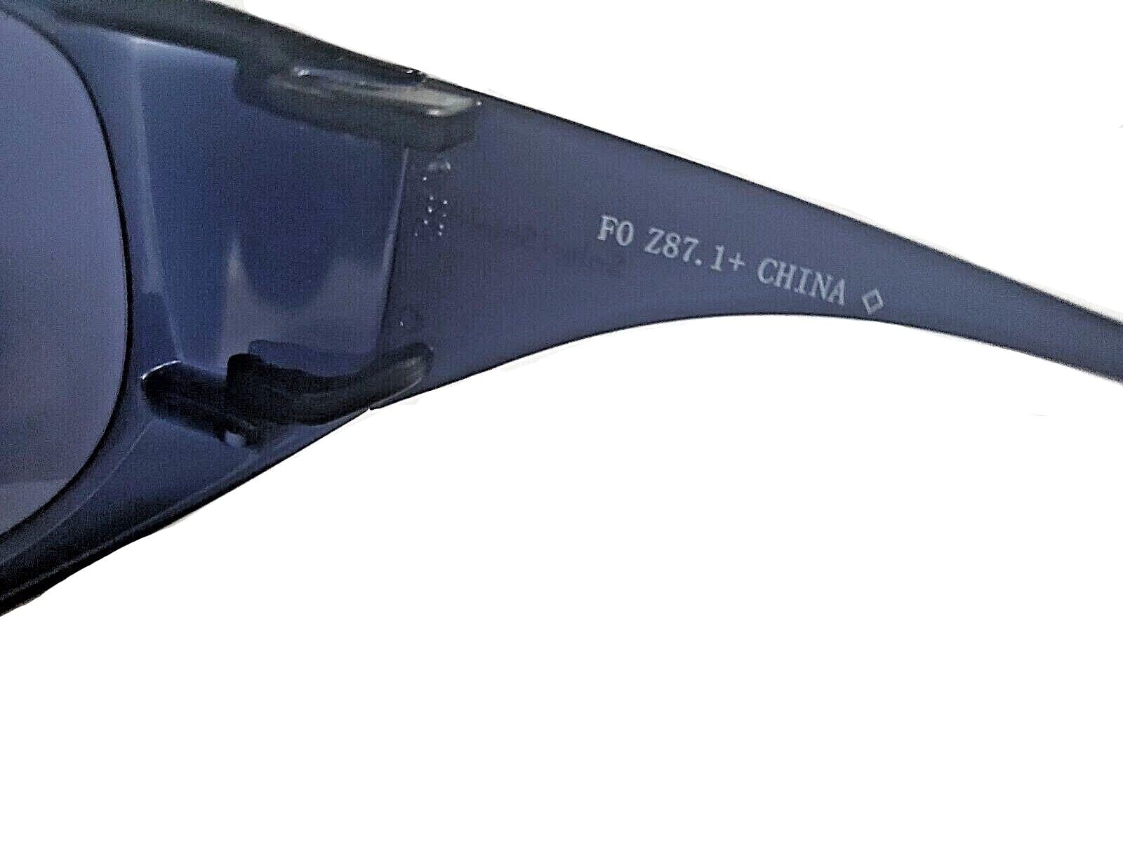 Solar Shield fits-over sunglasses worn by model for daily outdoor use.