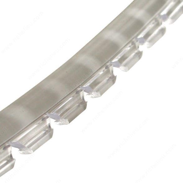 Cabinet door glass held steady as wood expands and contracts with Sommerfeld's retainer.